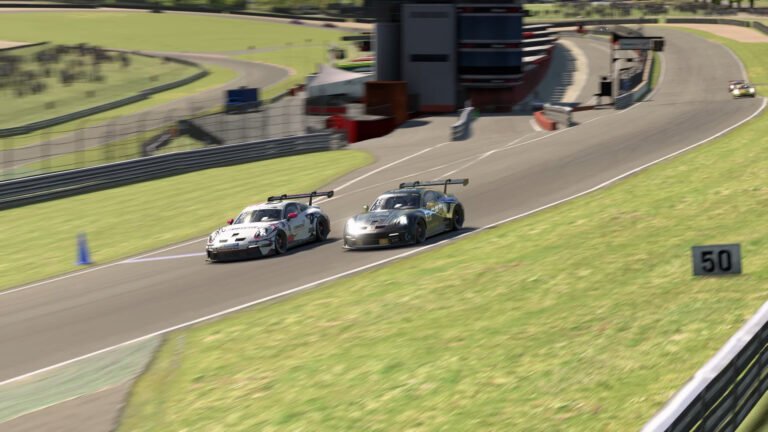 Two iRacing GT3 cars in a close wheel-to-wheel battle on a road course, showing the side-by-side positioning at the heart of advanced racecraft situations