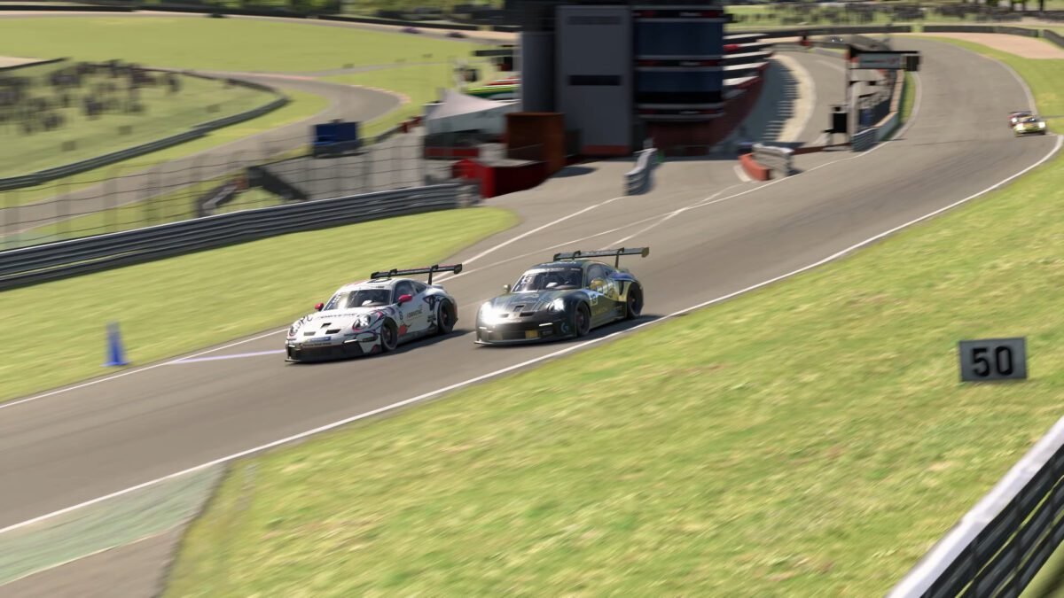 Two iRacing GT3 cars in a close wheel-to-wheel battle on a road course, showing the side-by-side positioning at the heart of advanced racecraft situations