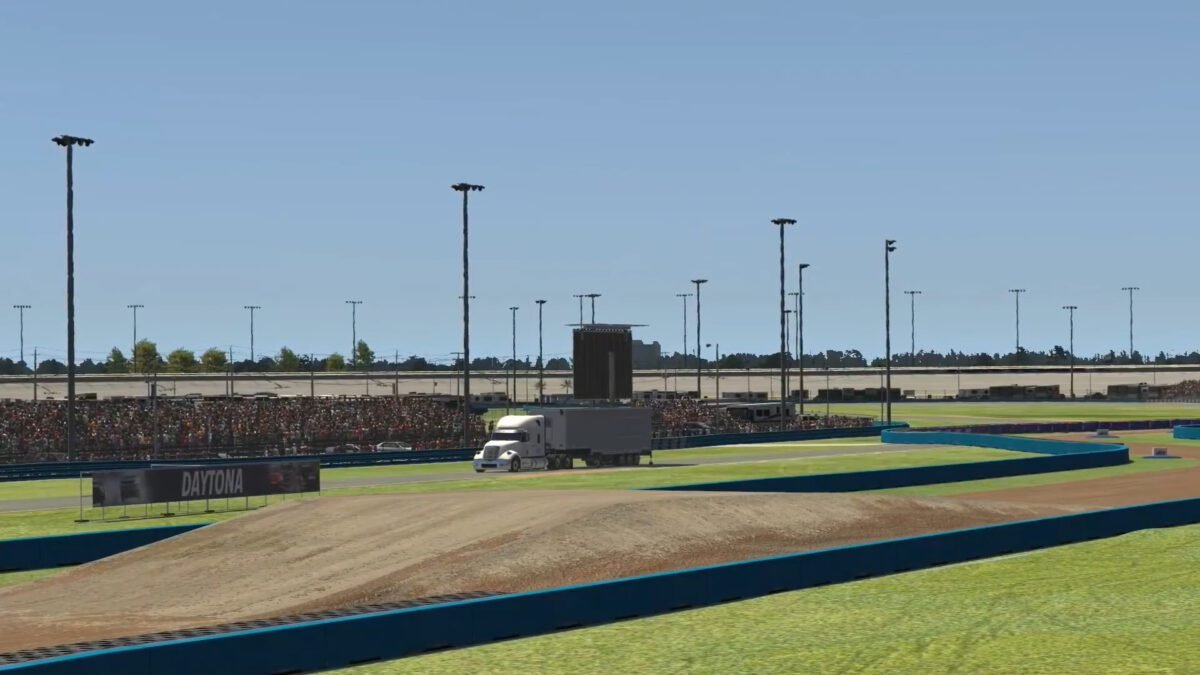 iRacing rallycross cars racing side by side on the mixed-surface Daytona Rallycross circuit