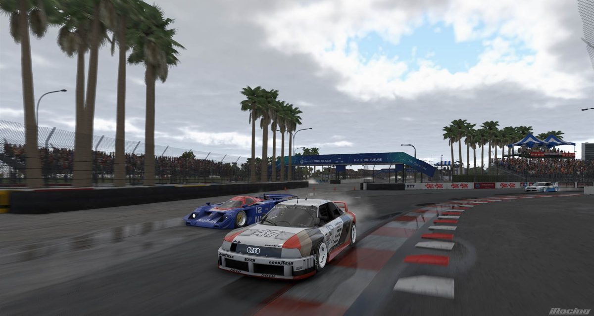 Vintage IMSA GTO and GTP cars racing wheel-to-wheel in iRacing