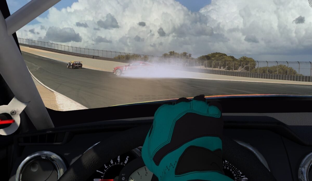 iRacing cockpit view showing a car spinning in iRacing, with rear-end rotation visible on track