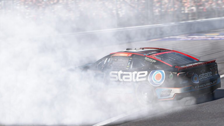 Connor Yeroschak celebrates after winning the eNASCAR Coca-Cola iRacing Series race at Kansas Speedway 2026
